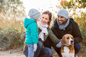 Image showing happy family with beagle dog outdoors in autumn