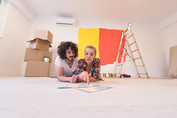 Image showing Happy young couple relaxing after painting