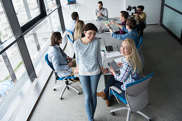 Image showing Pretty Businesswomen Using Tablet In Office Building during conf