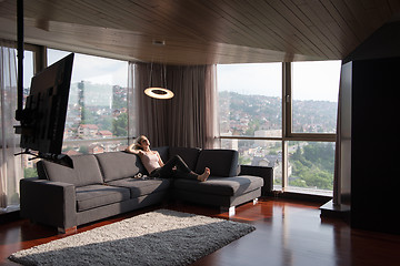 Image showing woman using tablet in beautiful apartment