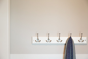 Image showing Wall in House with Scarf Hanging on Coat Rack Hooks Abstract