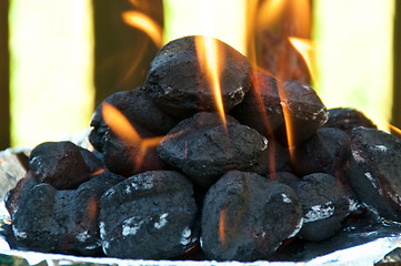 Image showing Eye level Flaming BBQ briquettes 