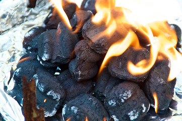 Image showing Flaming BBQ briquettes 