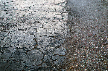 Image showing dried cracked black asphalt roadway texture