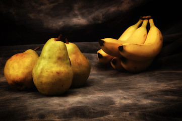 Image showing bosc pears and yellow bananas on gray studio backdrop