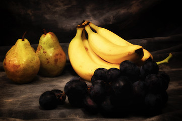 Image showing grapes pears and bananas on gray studio backdrop