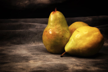 Image showing three bosc pears on gray studio backdrop