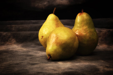 Image showing three ripe pears on gray studio backdrop
