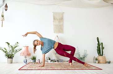 Image showing young woman doing yoga at studio