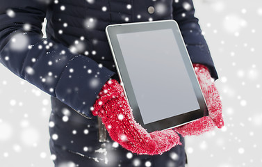 Image showing close up of woman with tablet pc in winter