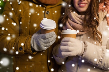 Image showing close up of happy couple with coffee at christmas