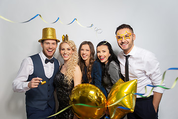 Image showing friends with party props and confetti laughing