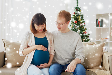 Image showing pregnant wife with husband at home at christmas