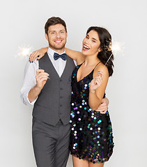 Image showing happy couple with sparklers at party