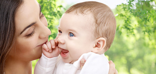 Image showing mother with baby over green natural background