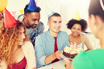 Image showing team greeting colleague at office birthday party