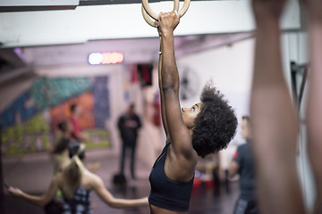 Image showing black woman doing dipping exercise