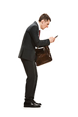 Image showing Full body portrait of businessman with briefcase on white