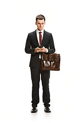 Image showing Full body portrait of businessman with briefcase on white