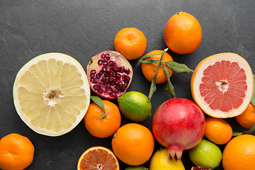 Image showing close up of citrus fruits on stone table