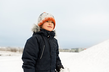 Image showing happy little boy in winter clothes outdoors