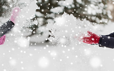 Image showing happy friends playing with snow in winter