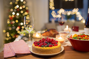Image showing cake and other food on christmas table at home
