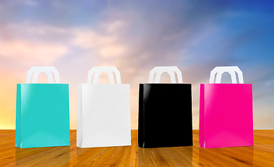 Image showing many shopping bags over sky background