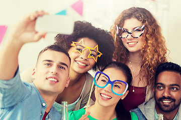 Image showing happy team taking selfie at office party