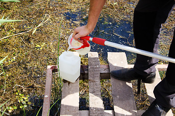 Image showing Take samples of water for laboratory testing. The concept - anal