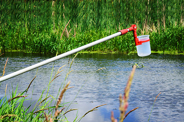 Image showing Take samples of water for laboratory testing. The concept - anal