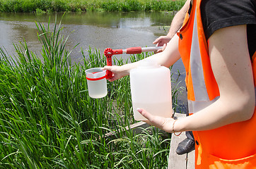 Image showing Take samples of water for laboratory testing. The concept - anal