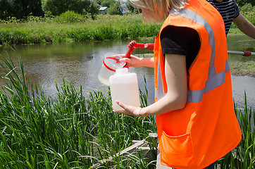 Image showing Take samples of water for laboratory testing. The concept - anal