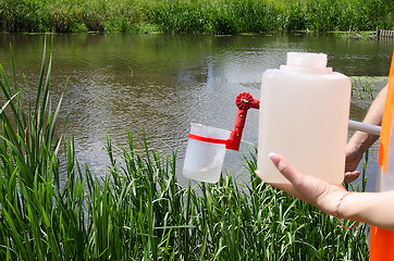 Image showing Take samples of water for laboratory testing. The concept - anal