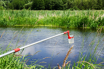 Image showing Take samples of water for laboratory testing. The concept - anal