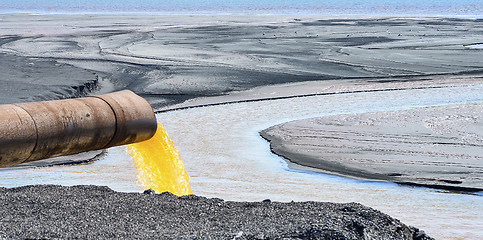 Image showing The industrial wastewater is discharged from the pipe into the water