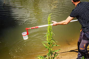 Image showing Take samples of water for laboratory testing. The concept - anal