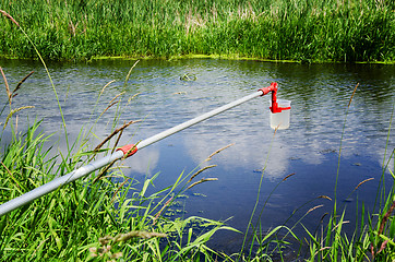 Image showing Take samples of water for laboratory testing. The concept - anal