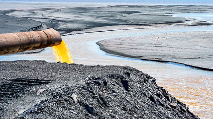 Image showing The industrial wastewater is discharged from the pipe into the water