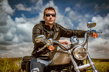 Image showing Biker on a motorcycle