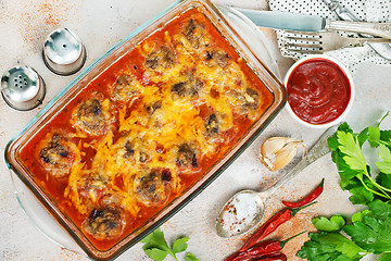 Image showing baked meatballs with sauce