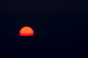 Image showing Setting Sun and Cloud Isolated on Black