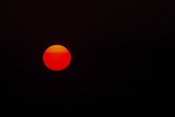 Image showing Setting Sun Isolated on Black