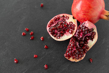 Image showing close up of pomegranate on stone table
