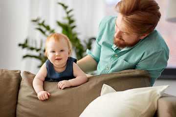 Image showing happy father with little baby daughter at home