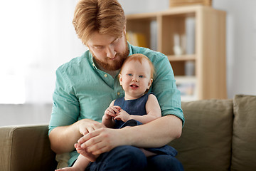 Image showing happy father with little baby daughter at home