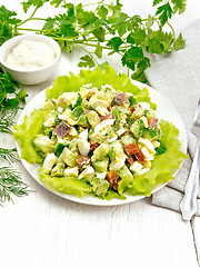 Image showing Salad of salmon and avocado on light wooden board