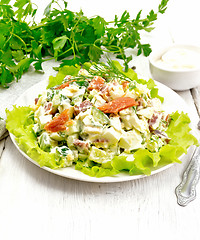 Image showing Salad of salmon and avocado with mayonnaise on board