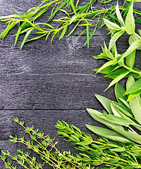 Image showing Frame of spicy herbs on wooden table