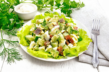 Image showing Salad of salmon and avocado on wooden board